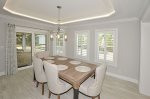 Dining Room with raised tray ceiling & direct access to screened patio.